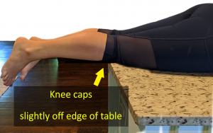 Knees off table edge